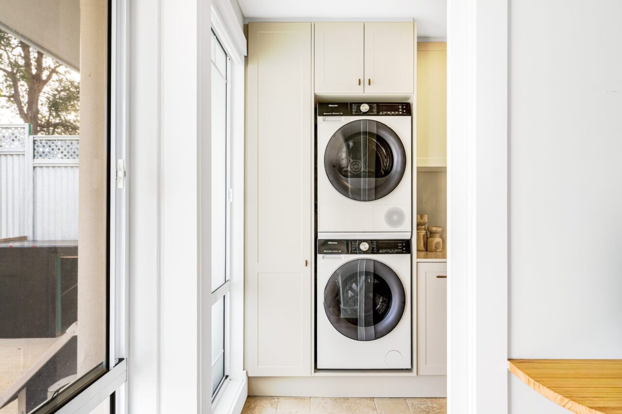 Stacked washer and dryer in a built-in laundry cabinet, Mount Riverview