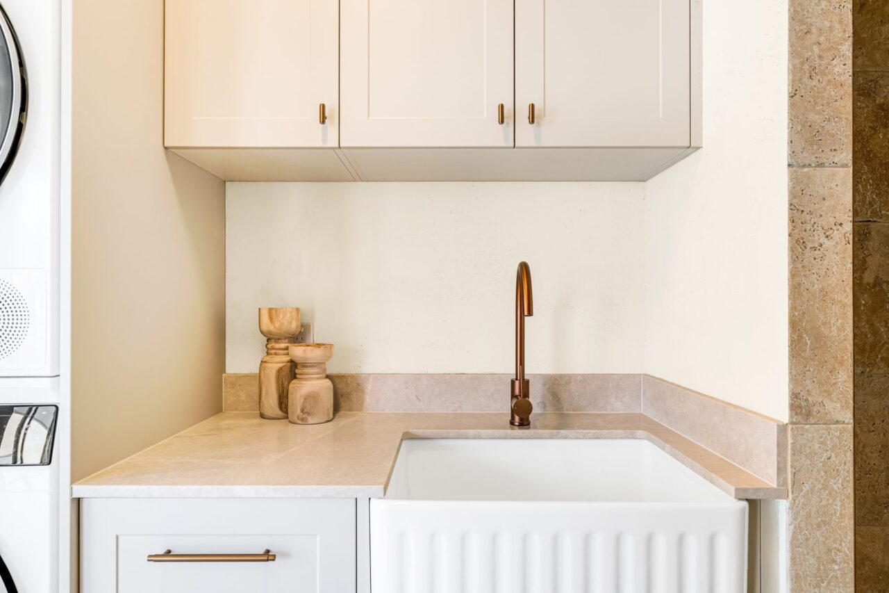 Fluted butler's sink with copper tapware under shaker cabinets, Mount Riverview